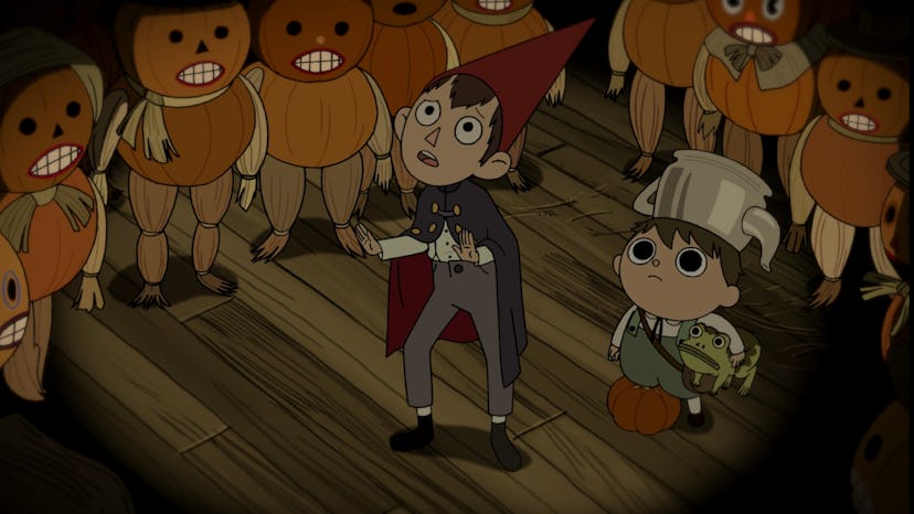 Greg and Wurt surrounded by pumpkin people in 'Over The Garden Wall.'