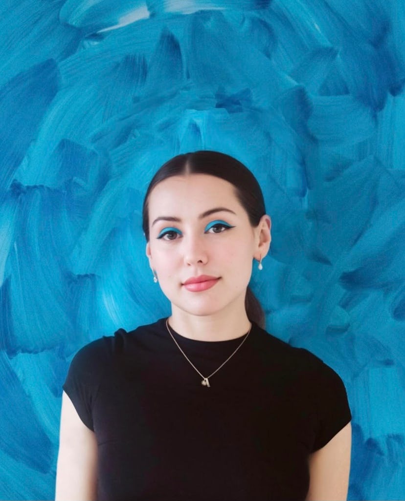Caroline Calloway against a blue background