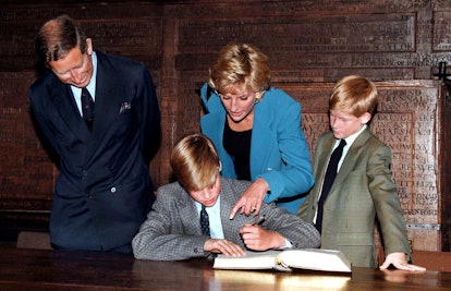 Prince William follows Eton tradition by signing a book before starting at the school, as Prince Cha...