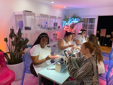 I went to the 2023 Poosh pool party with a nail salon. 