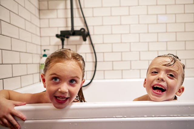 Siblings take a bath together.