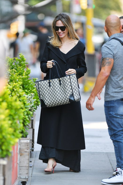 Angelina Jolie sports an all black ensemble as she meets up with friends for brunch at Il Buco Alime...