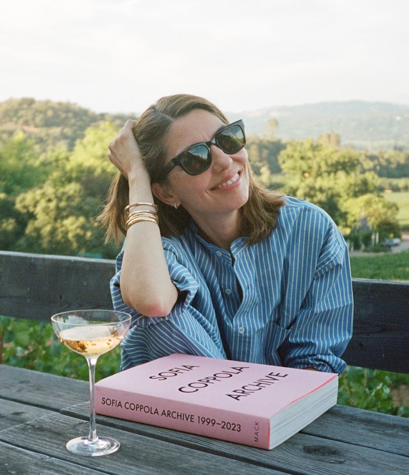 Sofia Coppola sitting with her book, Archive 