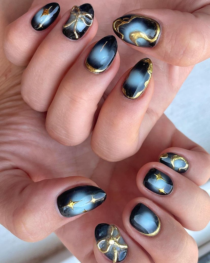 Gold galaxy nails.