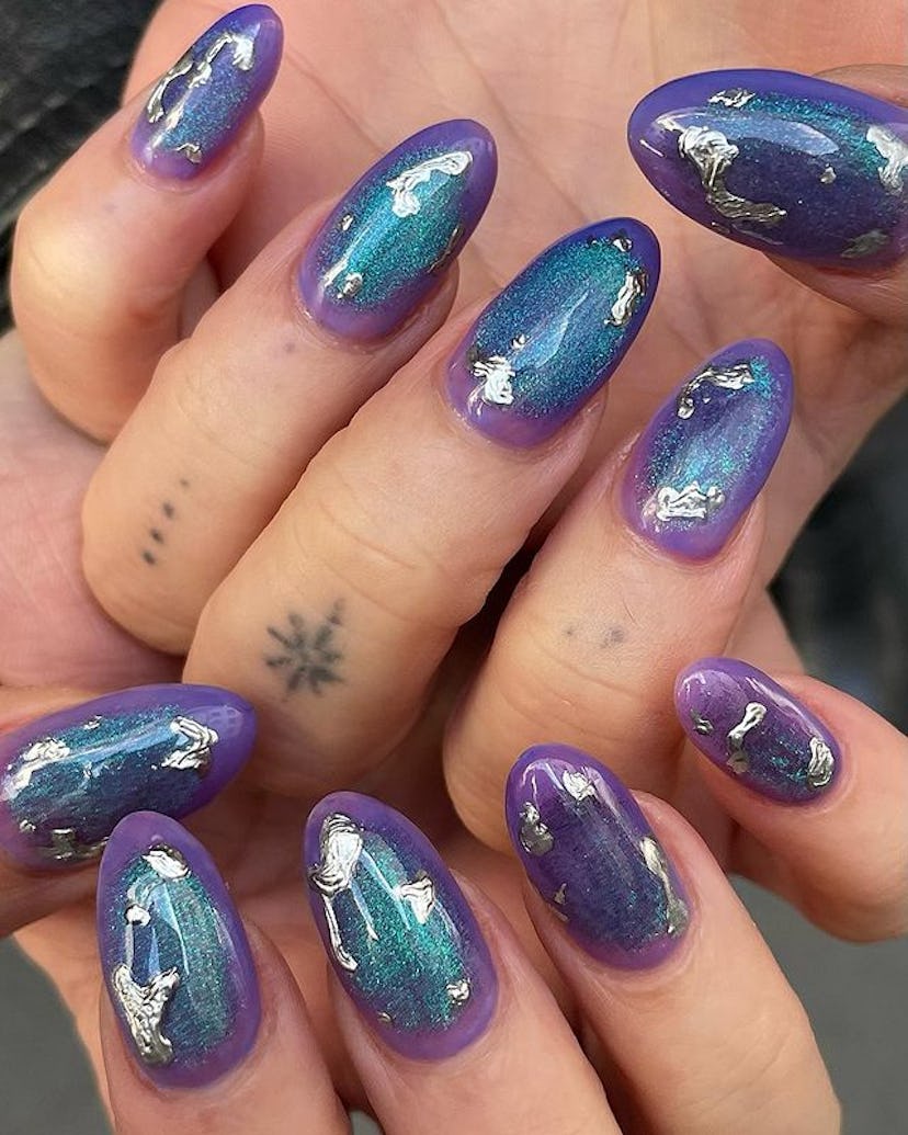 Purple galaxy nails.