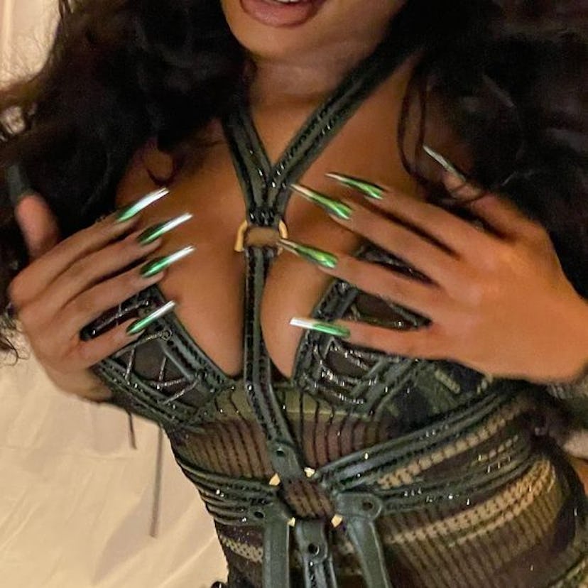 Megan Thee Stallion's green & silver chrome gradient nails, painted by Coca Michelle for Beyoncé's's...