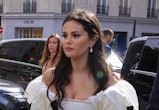 Selena Gomez wears a white polka dot puff-sleeve dress in Paris, France during september 2023 fashio...