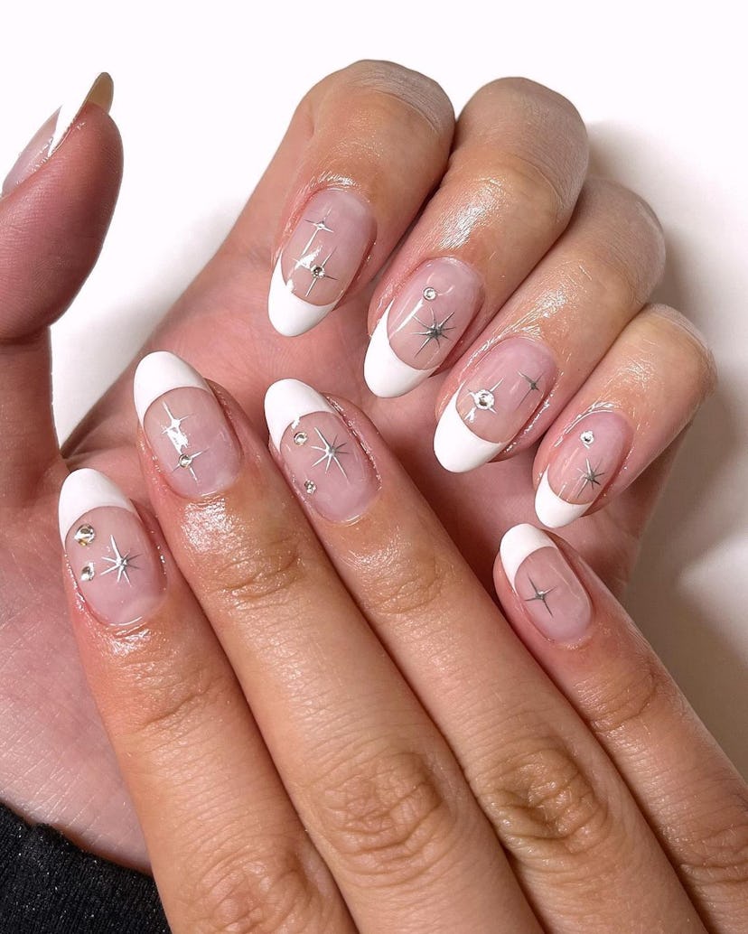 Try a medium-length French manicure with silver chrome nail art this Libra season.