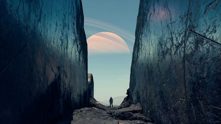 A person is seen in a chasm with a planet visible in the sky's background in a Starfield screenshot.