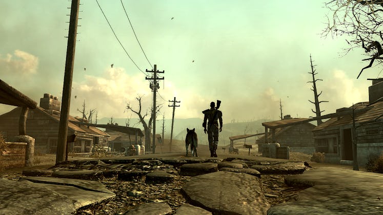 A character and canine sidekick Dogmeat walk through the wasteland.