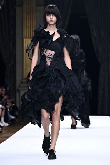 A model presents a creation for the Japanese Fashion House Yohji Yamamoto during the Paris Fashion W...