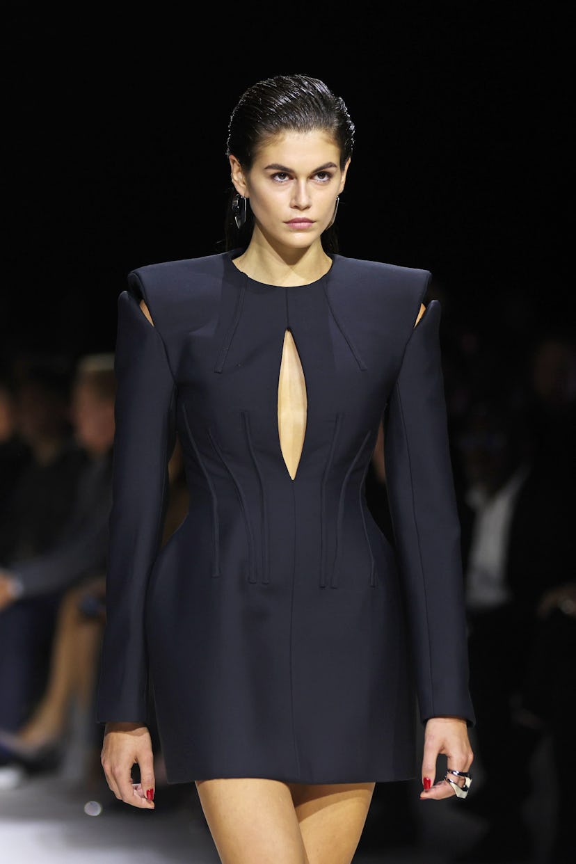 Kaia Gerber walks the runway at the Alexander McQueen SS24 show during Paris Fashion Week at Le Carr...