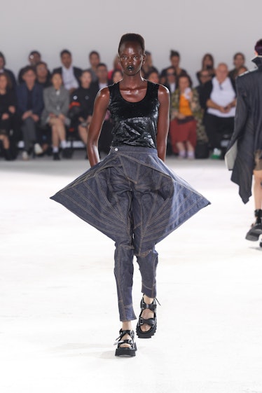 A model walks the runway during the Junya Watanabe Womenswear Spring/Summer 2024 show as part of Par...