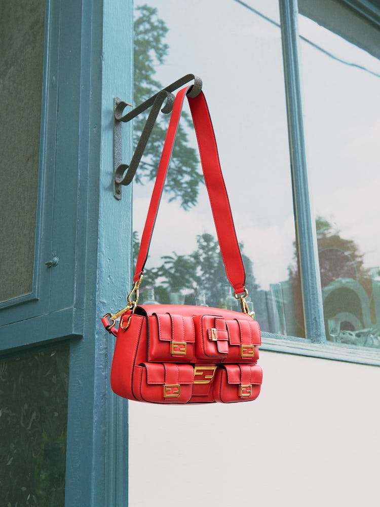 Red leather bag and strap.