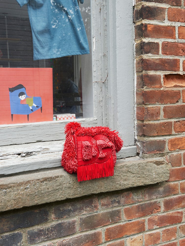 Red shredded handbag.
