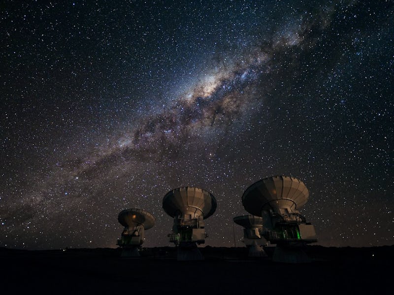 Four antennas of ALMA, the Atacama Large Millimeter/submillimeter Array. Across the image in the bac...