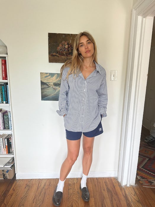 Aemilia Madden wears gym shorts with a striped button-up