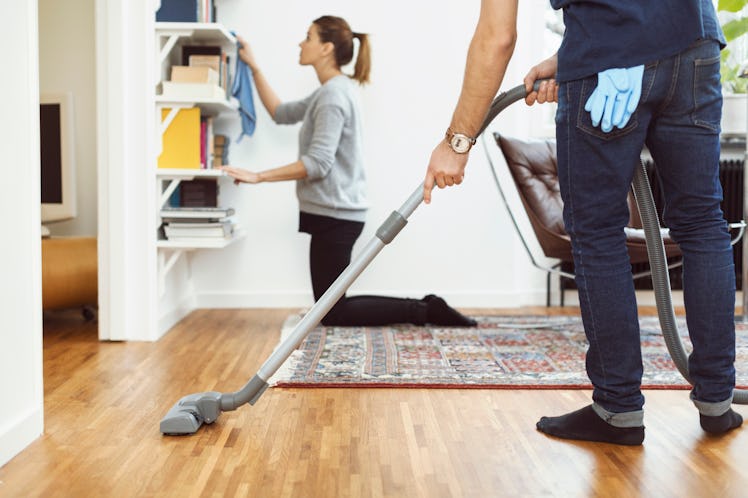 Man and woman doing chores around their home