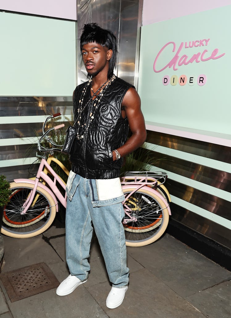 Lil Nas X, wearing CHANEL, attends the CHANEL party to celebrate the debut of the Lucky Chance Diner...