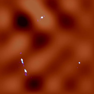 The whitish blue color represents the gravitationally lensed images observed by ALMA. The calculated...