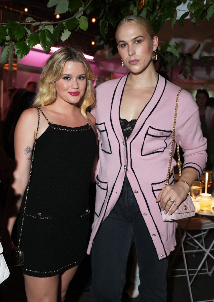 Ava Phillippe and Tommy Dorfman, both wearing CHANEL, attend the CHANEL party to celebrate the debut...