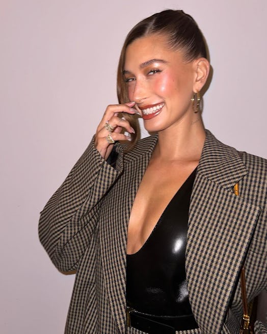 Hailey Bieber wears a Saint Laurent blazer and skirt in a photo posted to Instagram.