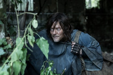 Daryl Dixon (Norman Reedus) crouches in a building in 'The Walking Dead: Daryl Dixon' Season 1