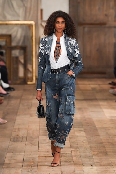 A model walks on the runway at the Ralph Lauren Spring 2024 Ready To Wear Fashion Show at the Brookl...