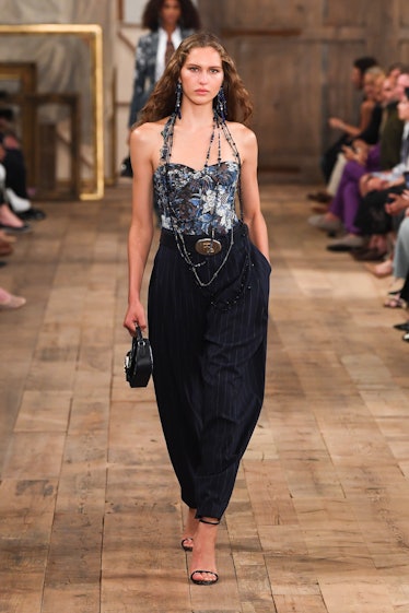 A model walks on the runway at the Ralph Lauren Spring 2024 Ready To Wear Fashion Show at the Brookl...