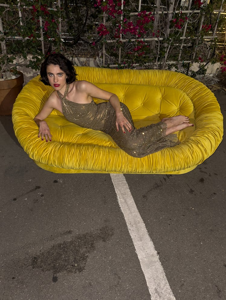 Qualley wears a Ralph Lauren Collection dress; her own rings.
