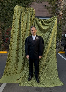 Gael García Bernal wears an Alexander McQueen jacket, shirt, pants, and brooch; Church’s shoes. 