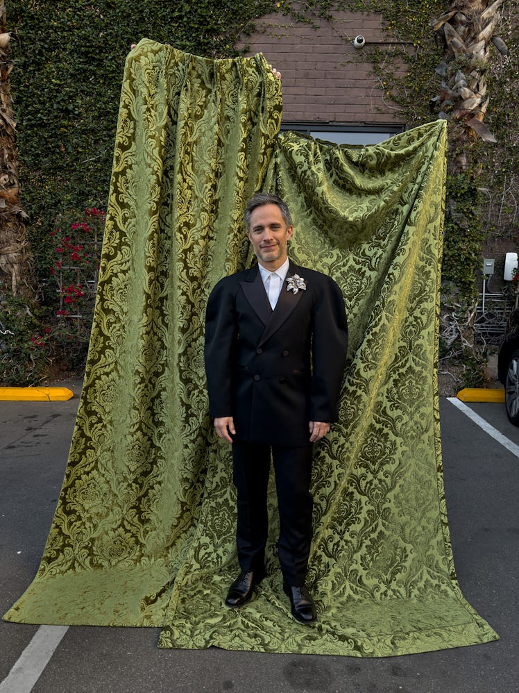 Gael García Bernal wears an Alexander McQueen jacket, shirt, pants, and brooch; Church’s shoes.