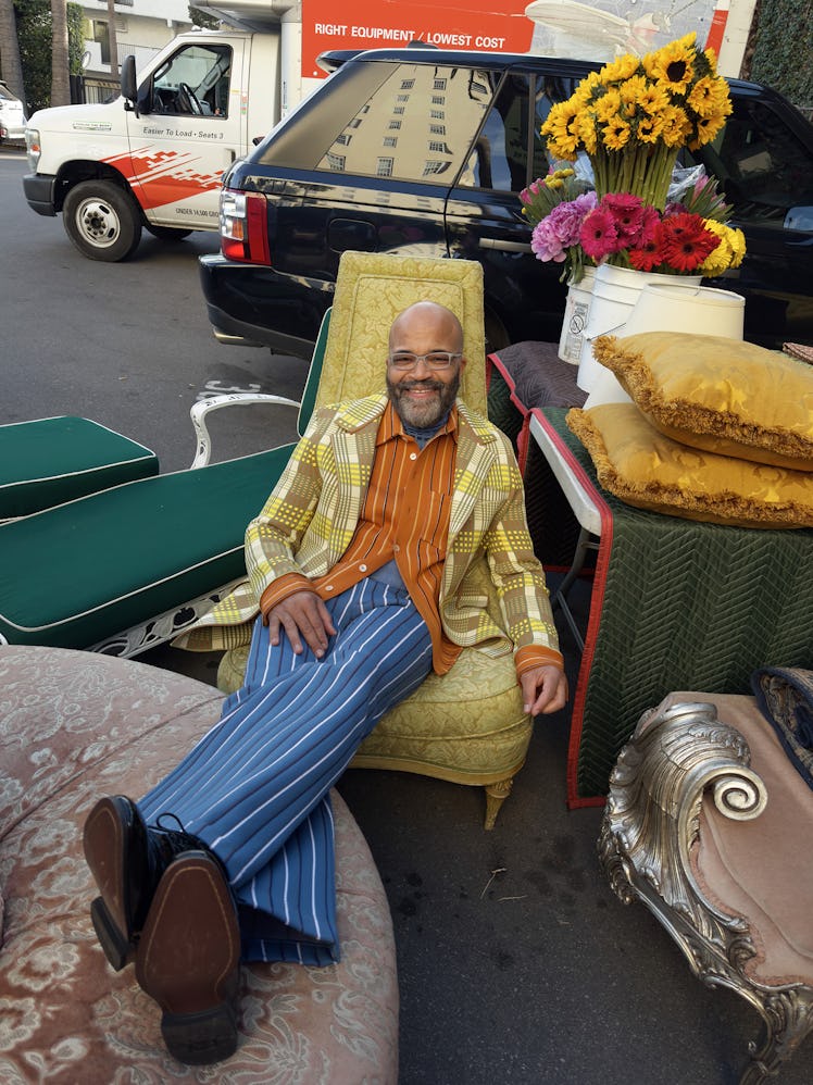 Jeffrey Wright wears a Marni jacket, shirt, turtleneck, and pants; Boss shoes; his own glasses throu...