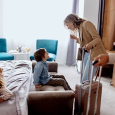 A family checks into a hotel room.