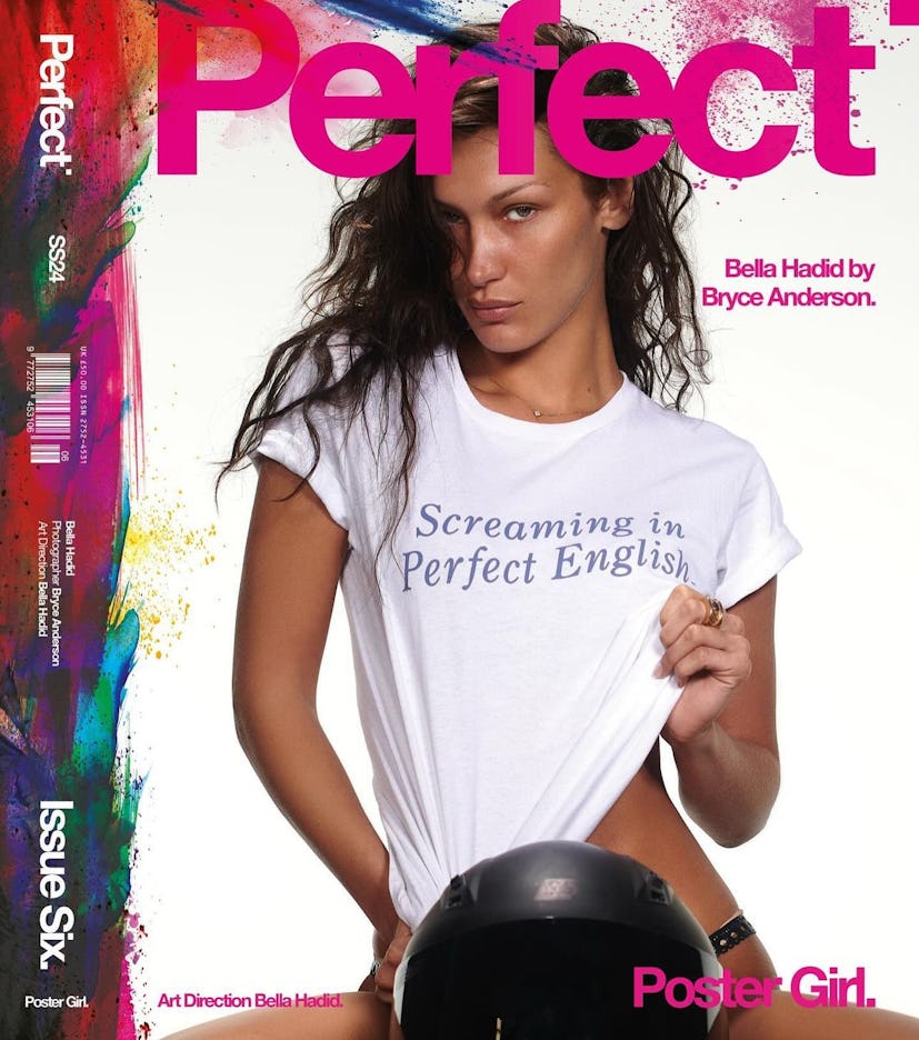 Bella Hadid wears a white graphic tee and a black thong on the cover of Perfect Magazine