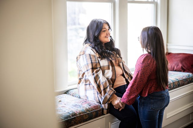 A mother talks to her daughter.