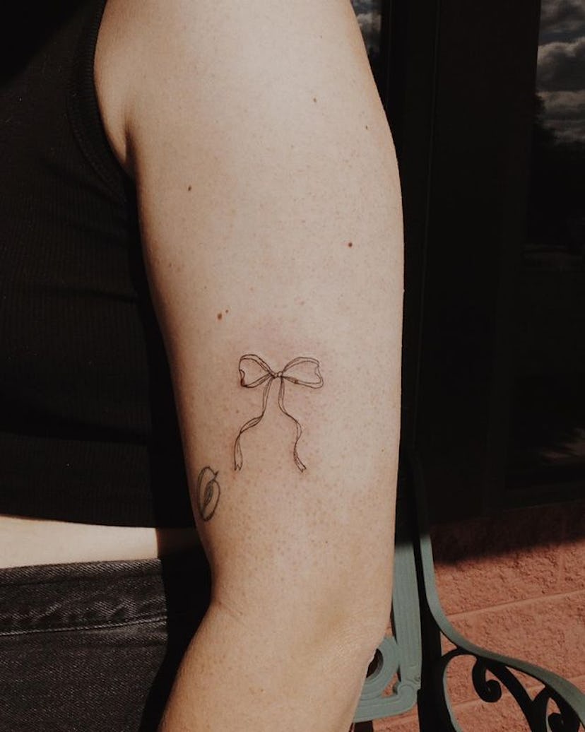 Coquette bow tattoos are trending in 2024.