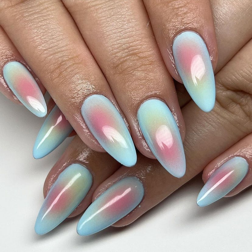 Cotton candy aura art on short almond nails are on-trend for 2024.