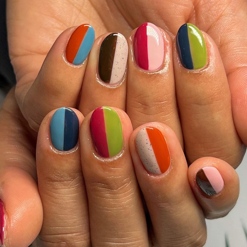 Two-tone Skittle nails on short almond nails are on-trend for 2024.