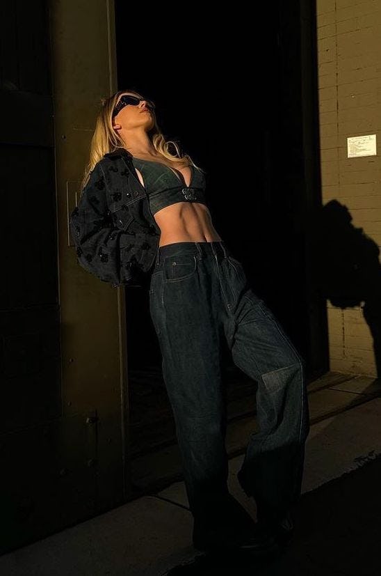 Sydney Sweeney wears a bedazzled denim jacket, jeans, and a denim bra.