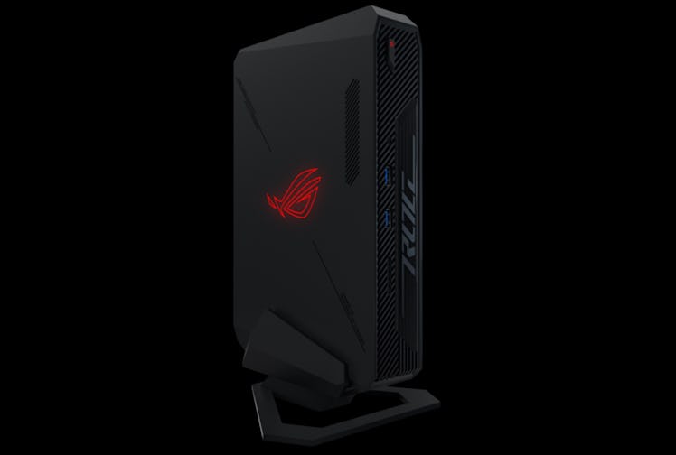 A slim and compact gaming PC with a glowing logo on the side.