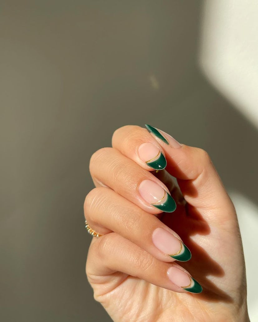 Double-lined French tip details on short almond nails are on-trend for 2024.