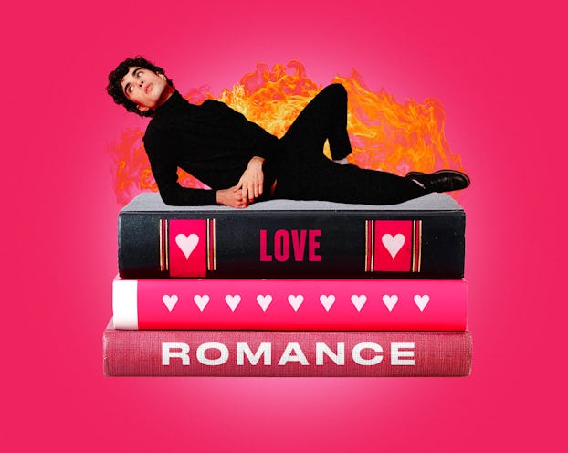 a boy sitting on top of romance books, representing a hot Book Boyfriend that's viral on TikTok