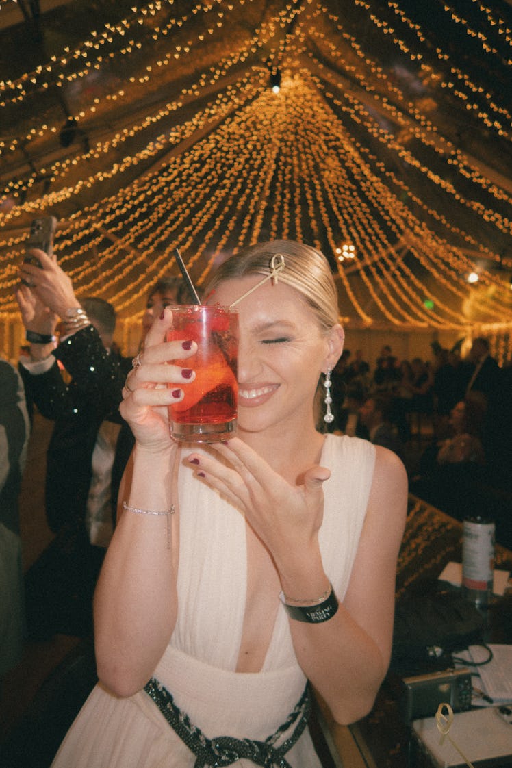 Anna Sitar enjoys a Shirley Temple at the Golden Globes viewing party. 