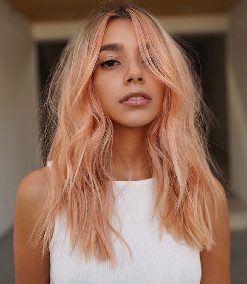Peach fuzz is the Pantone color of the year, and it’s also a fun hair color.