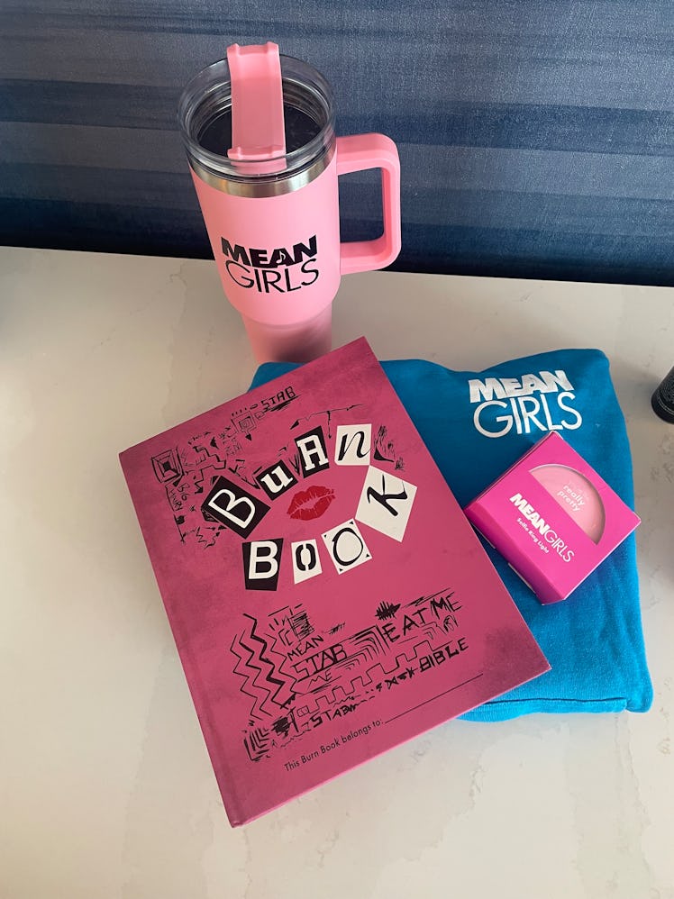 'Mean Girl's merchandise, including a hoodie, tumbler, ring light, and Burn Book