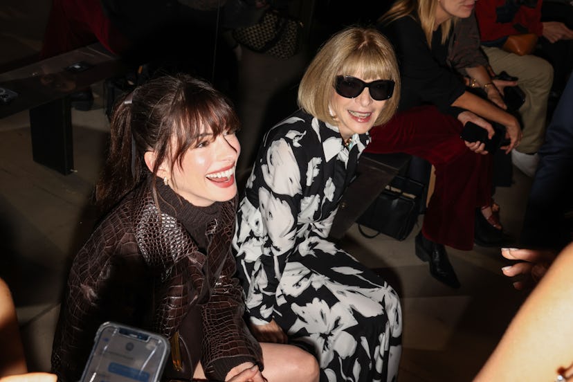 Anne Hathaway and Anna Wintour attend the Michael Kors SS23 runway show.