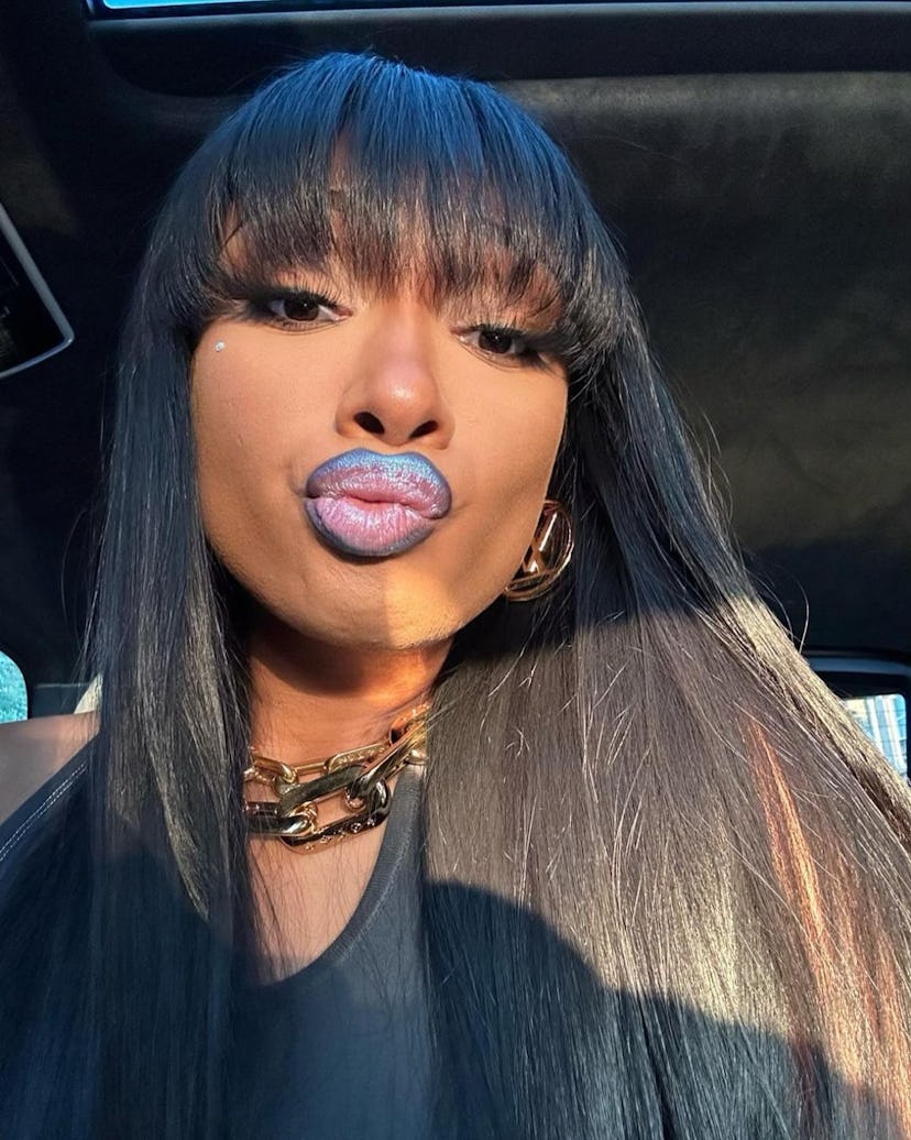 Megan Thee Stallion wearing blue frosted lip liner.