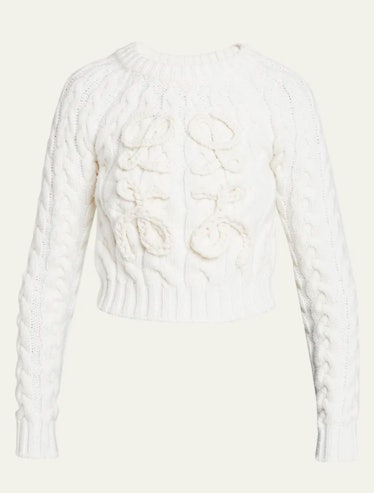 white cable-knit sweater
