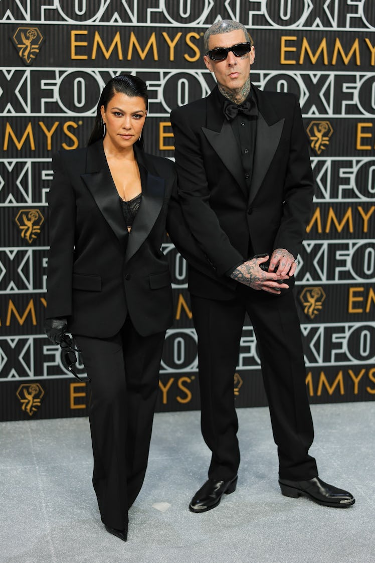 Kourtney Kardashian and Travis Barker attend the 75th Primetime Emmy Awards at Peacock Theater on Ja...